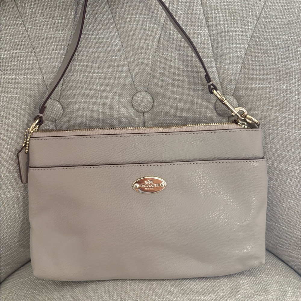 Coach Taupe Leather pochette wristlet shoulder bag.
